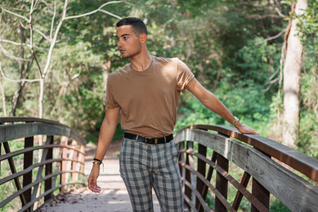 Man posing on bridge for lifestyle photography